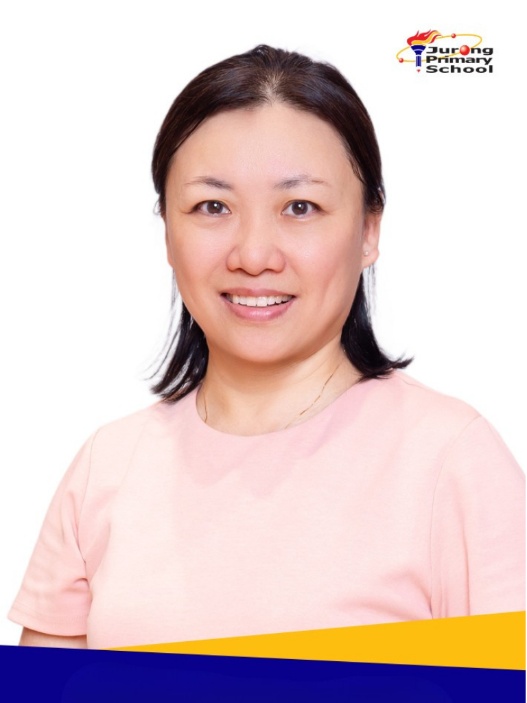 Smiling woman in pink top, short dark hair, thin necklace